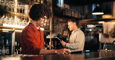 Buy stock photo Business, man and bartender in restaurant, tablet and digital app for inventory, counter and internet. People, employees and hospitality with technology, alcohol or customer service with drinks order