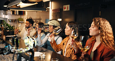 Buy stock photo Social gathering, group and friends with wine tasting at pub for experience, flavor and bonding. Night, people and drinking alcohol at restaurant for quality testing, weekend break and reunion event