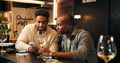 Buy stock photo Wine, friends and men with phone in restaurant for social media, online message and conversation. Nightclub, talking and people with alcohol drinks on smartphone for reunion, hangout and weekend