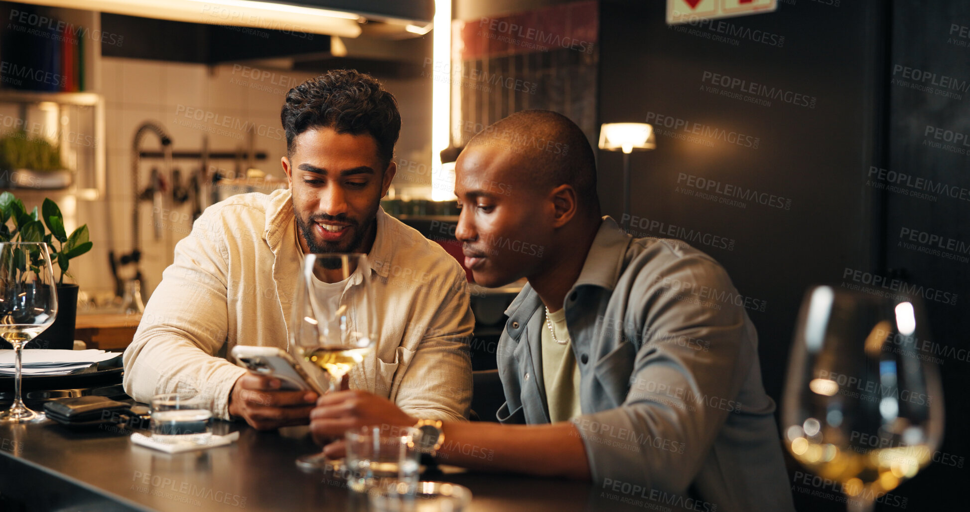Buy stock photo Wine, friends and men with phone in restaurant for social media, online message and conversation. Nightclub, talking and people with alcohol drinks on smartphone for reunion, hangout and weekend