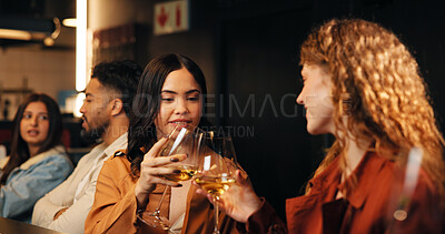 Buy stock photo Wine, restaurant and women at bar toast for celebration, conversation and bonding on night out. Happy hour, friends and people cheers with alcohol drinks for hangout, reunion and relax on weekend