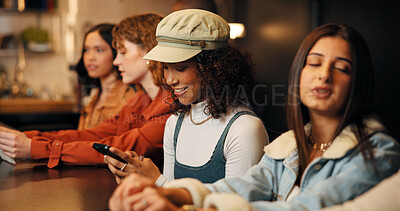 Buy stock photo Women, friends and night with phone for social event, get together or evening out in restaurant. Female people, group or smile with mobile smartphone in cafe for chat app or communication in dinner