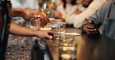 Buy stock photo Counter, alcohol and hands of waiter with glass for customer service, order and hospitality. Nightclub, pub and bartender pour drinks, beverage and liquid for serving people at bar in happy hour