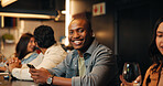 Wine, portrait and man with phone in restaurant for social media, online message and conversation. Nightclub, happy and people with alcohol drinks on smartphone for reunion, hangout and weekend