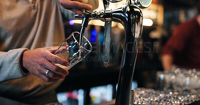 Buy stock photo Bartender, hands and glass with dispenser for draft, customer service or pouring drink in bar. Closeup, barman or preparing beverage with tap for alcohol, hospitality or order in restaurant or pub