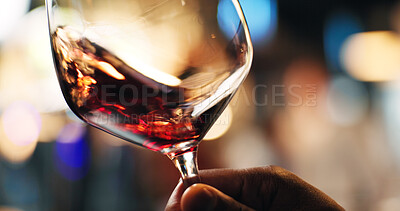 Buy stock photo Hand, person and swirl red wine in glass for taste testing, quality control and sensory ritual. Customer, inspection and alcohol for aroma, balance flavour and evaluation process and event with bokeh
