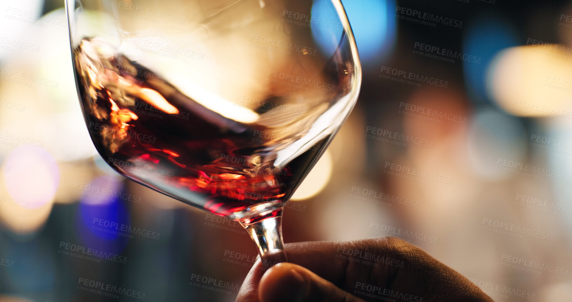Buy stock photo Hand, person and swirl red wine in glass for taste testing, quality control and sensory ritual. Customer, inspection and alcohol for aroma, balance flavour and evaluation process and event with bokeh