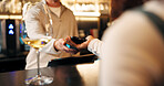 Bartender, hands and pos machine with phone for payment, wireless transaction or easy banking in bar. People, drink or customer with mobile smartphone or NFC for tap, EFT or ecommerce in restaurant