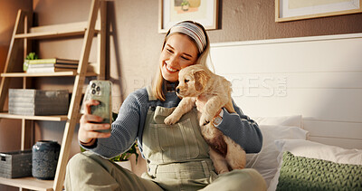 Buy stock photo Selfie, bed and relax with woman and puppy for social media post, pet influencer and love. Dog content creator, photography and golden retriever with person in home for animal care and trust