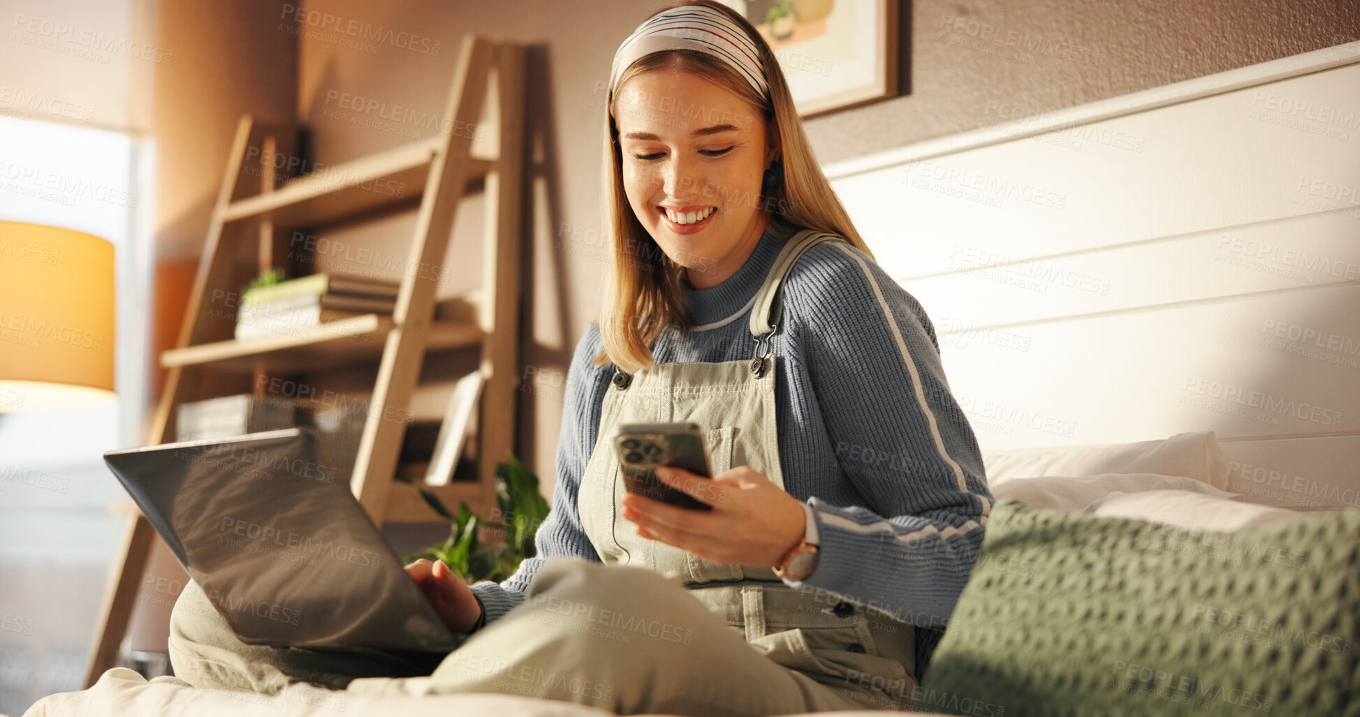 Buy stock photo Laptop, phone and relax with girl in bedroom of home for college or university communication. App, computer and smile with happy student sitting on bed to check class schedule for scholarship