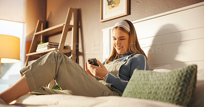 Buy stock photo Relax, phone and woman on bed with networking, connectivity or social media with mobile app. Happy, technology and female person with cellphone for online communication in bedroom at apartment.