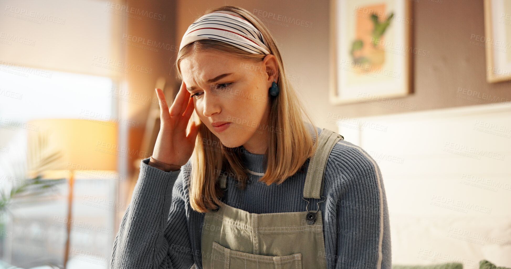 Buy stock photo Student, stress or girl with headache in home for college loans, financial debt or scholarship risk. Mental health, anxiety or person with tension migraine for university workload, fatigue or burnout