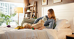 Toys, playing and woman with puppies on bed for learning, development and bonding after adoption. Pet owner, bedroom and person with Golden Retriever dogs for relaxing, relationship and animal care