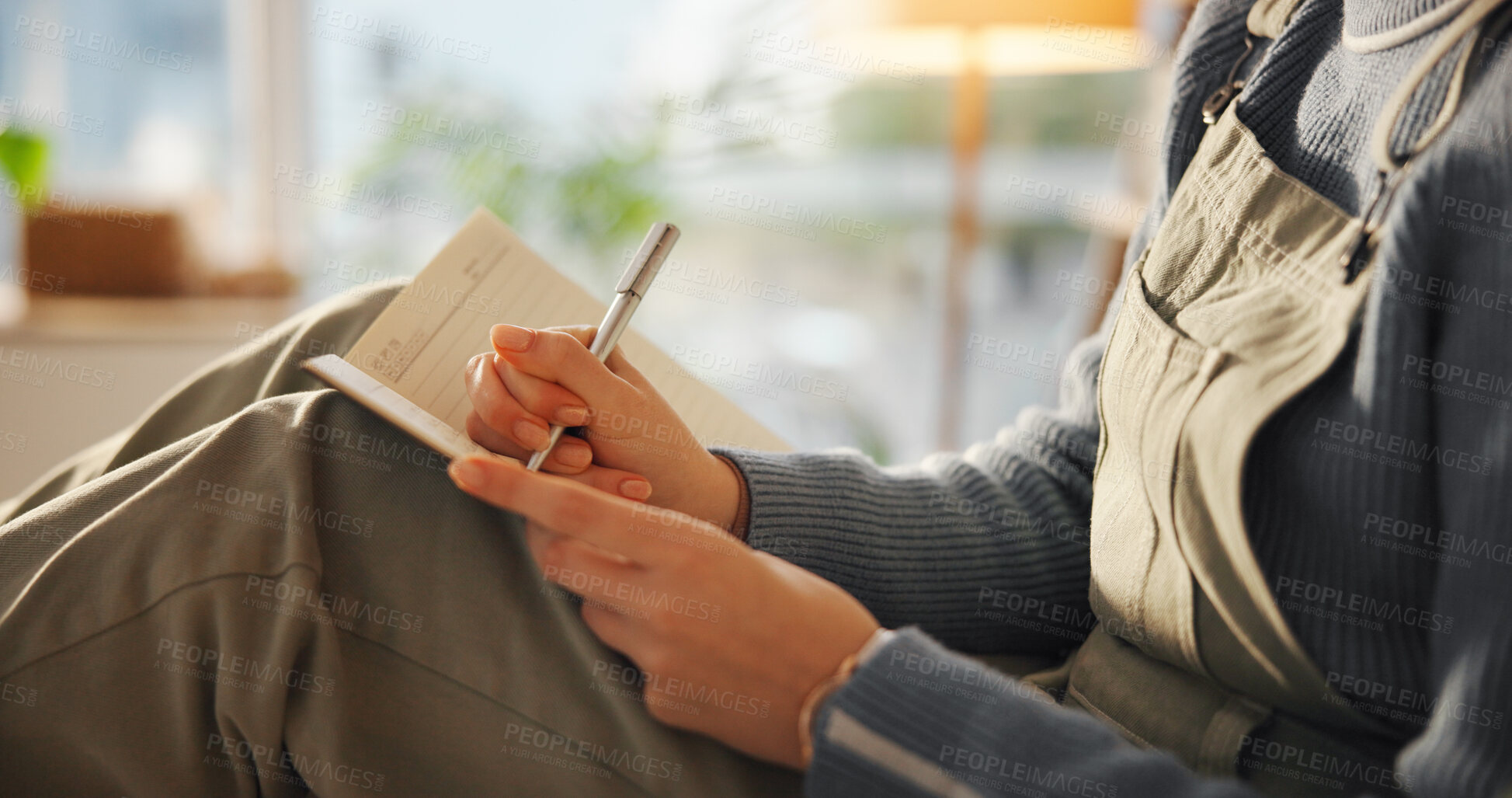 Buy stock photo Hands, person or writing in notebook in home for journal entry, schedule reminder or calendar tasks. Personal diary, woman and taking notes in apartment for to do list, inspiration and agenda planner