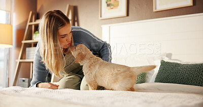 Buy stock photo Kiss, bonding and woman with dog on bed for playing, connection or adoption in home together. Love, relax and female person with Labrador puppy for pet, animal or companion in bedroom at house.