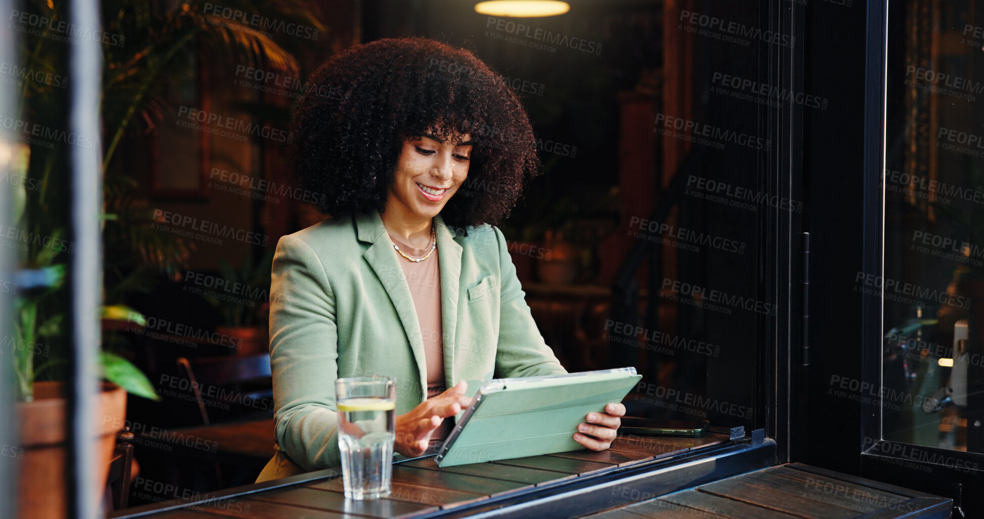 Buy stock photo Remote work, smile and tablet with woman in coffee shop for small business planning or research. App, freelance and reading with African employee in cafe or restaurant as customer and entrepreneur