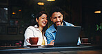 Laptop, coffee and couple in cafe with laugh, bonding or talking on morning date together. Happy, cappuccino and man with woman on computer for social media, research or reading blog in restaurant.