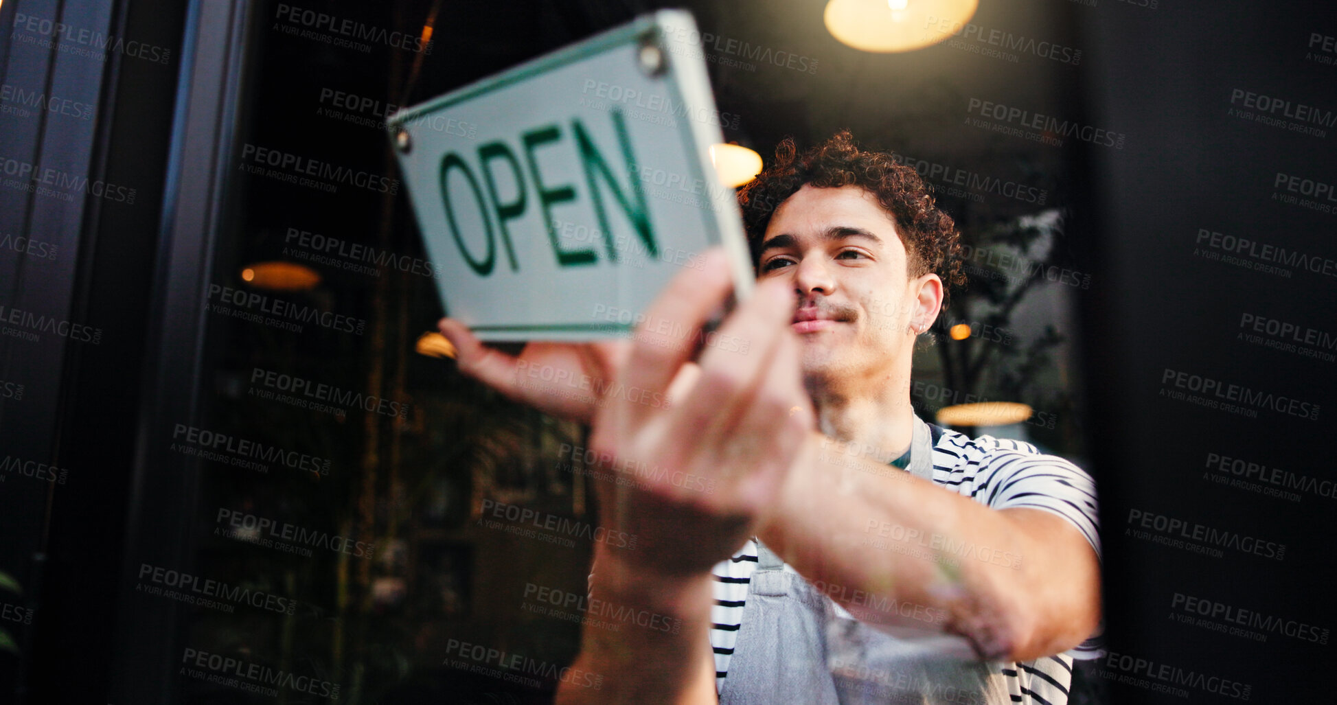 Buy stock photo Open sign, small business and window with waiter in coffee shop for hospitality, retail or service. Entrance, happy and opening with man in cafe or restaurant for startup announcement or signage