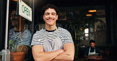 Buy stock photo Crossed arms, man and portrait of waiter at coffee shop entrance for welcome, customer service or job. Happy, confident and server with confidence for hospitality industry at doorway of restaurant.