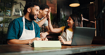 Buy stock photo Happy people, team and laptop with high five in cafe for small business success together. Group, employees or celebration with computer or smile for promotion, profit or good review in coffee shop