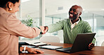 Business people, handshake and meeting with laptop for hiring, thank you or recruiting in office. Businessman, woman or colleagues shaking hands with smile or technology for onboarding in workplace