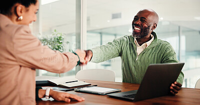 Buy stock photo Business people, handshake and meeting with laptop for hiring, thank you or recruiting in office. Businessman, woman or colleagues shaking hands with smile or technology for onboarding in workplace