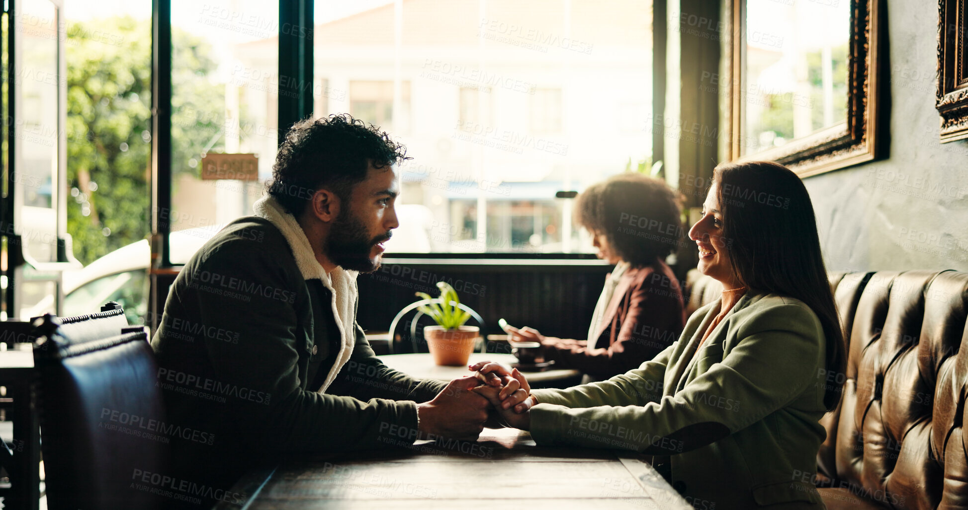 Buy stock photo Happy, date and couple holding hands in restaurant for bonding, romance and together in cafe. Love, relax and man with woman to celebrate anniversary, relationship and connection in conversation