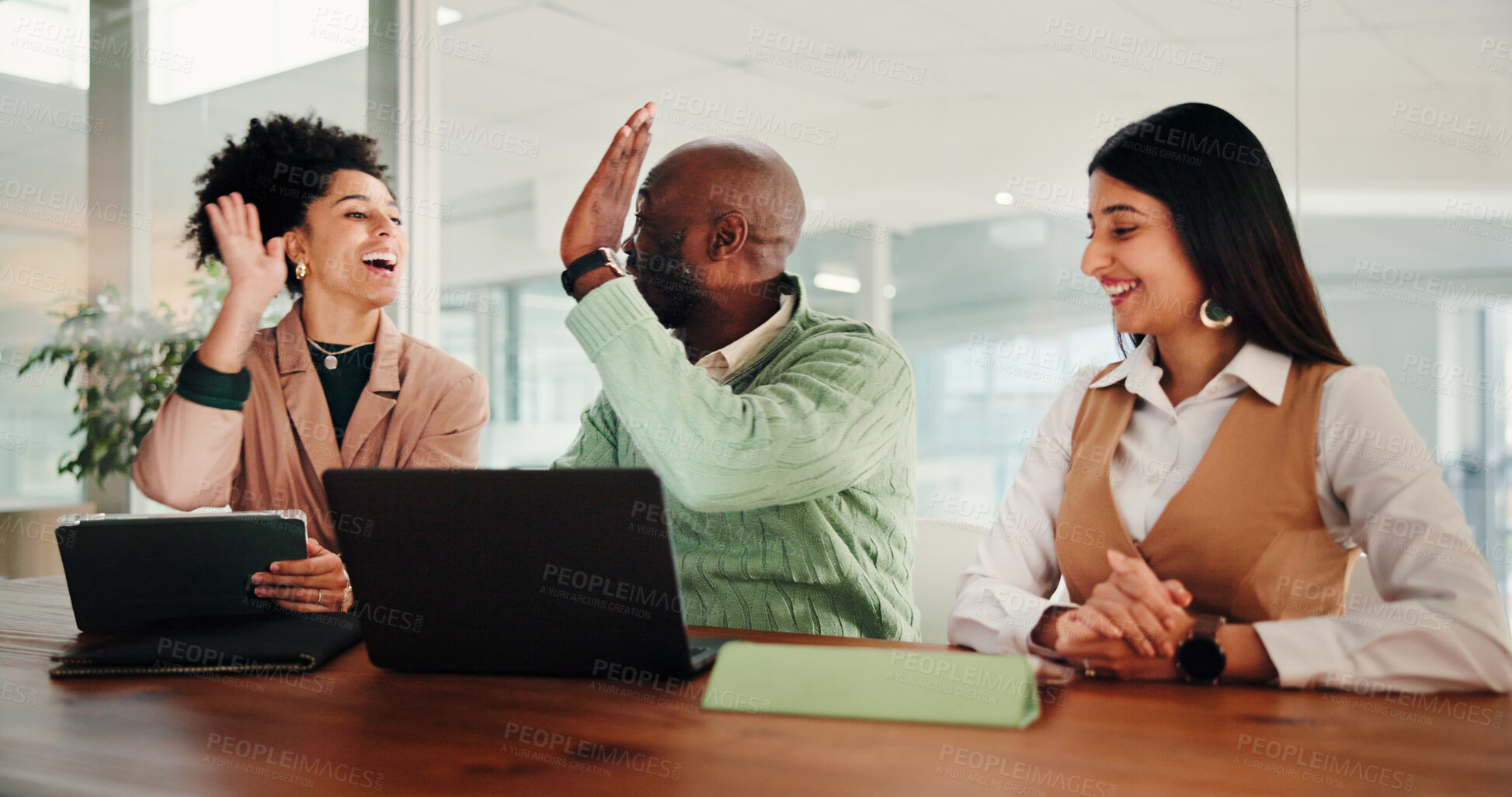 Buy stock photo Business people, team and high five with tech at startup with smile, success and motivation for goals at office. Man, women and celebration with tablet, laptop or collaboration at creative agency