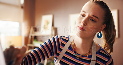 Buy stock photo Woman, artist and painting on canvas in studio for art, design process and creating artwork. Female person, easel and sketch drawing, crafts technique and diy creation for creative project at house