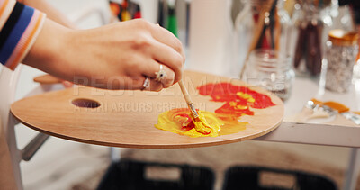 Buy stock photo Hands, paintbrush and palette with artist in studio apartment for creative expression or inspiration. Art, mixing acrylic and painting with talented person in home for hobby, practice or skill