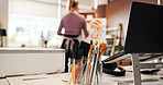 Paint brush, paper and tools in studio for creativity, design and artwork development in home. Person, painter and artist with equipment, back and inspiration for talent with canvas at workshop