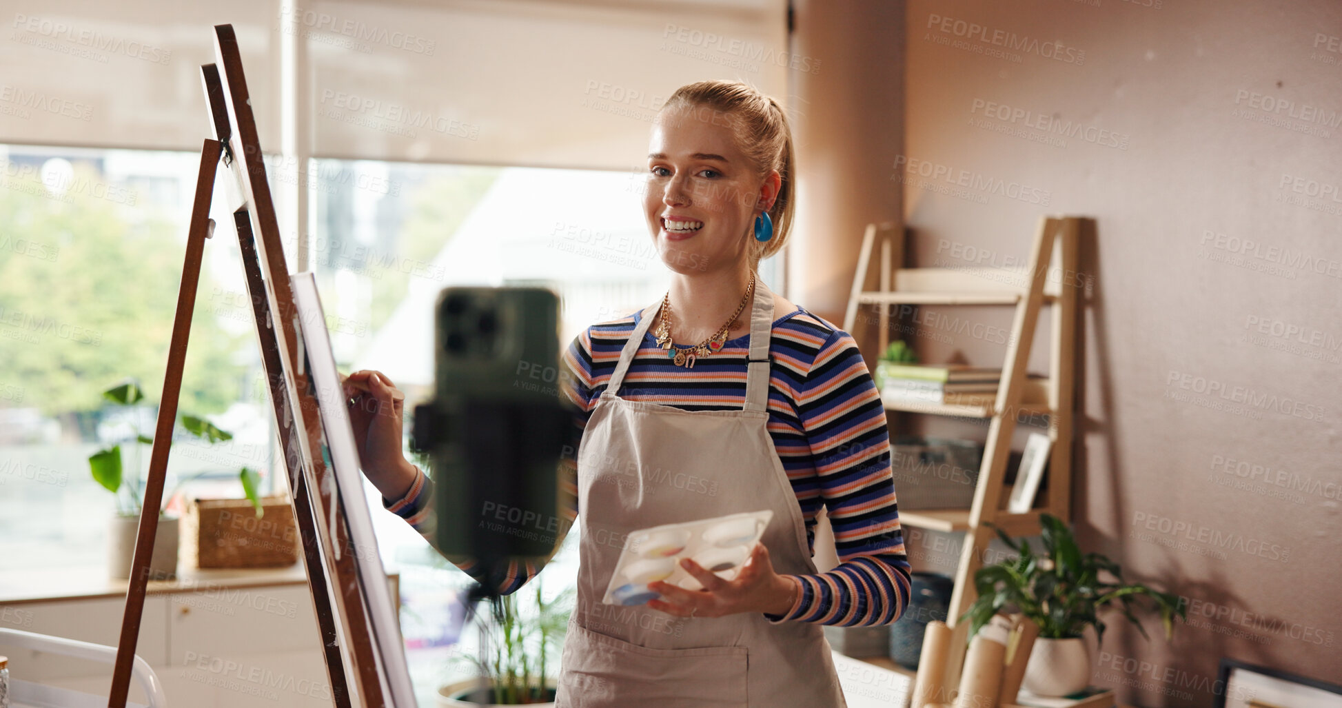 Buy stock photo Painter, phone and woman recording a video in home studio for creative hobby, advice and tips. Art influencer, artist and happy with live streaming for painting process, audience engagement or skills