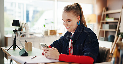 Buy stock photo Woman, artist and phone with texting at workshop, smile and contact for deal, networking or web shop. Person, creative and happy with smartphone, app and social media marketing for painting sales