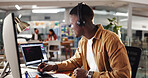 Laptop, graphic design and man in office, headphones and listening to music, internet and connection. Creative agency, person and employee in workplace, computer and audio with planning and ideas