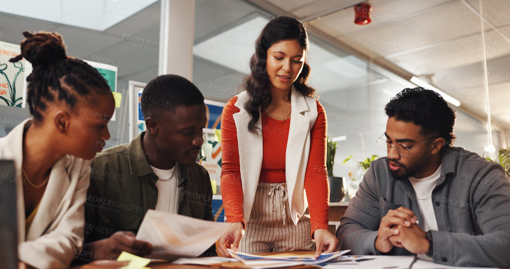 Buy stock photo Creative, documents and woman with team in meeting for planning, brand layout and project ideas. Startup agency, collaboration and workers brainstorming for design process, feedback and strategy