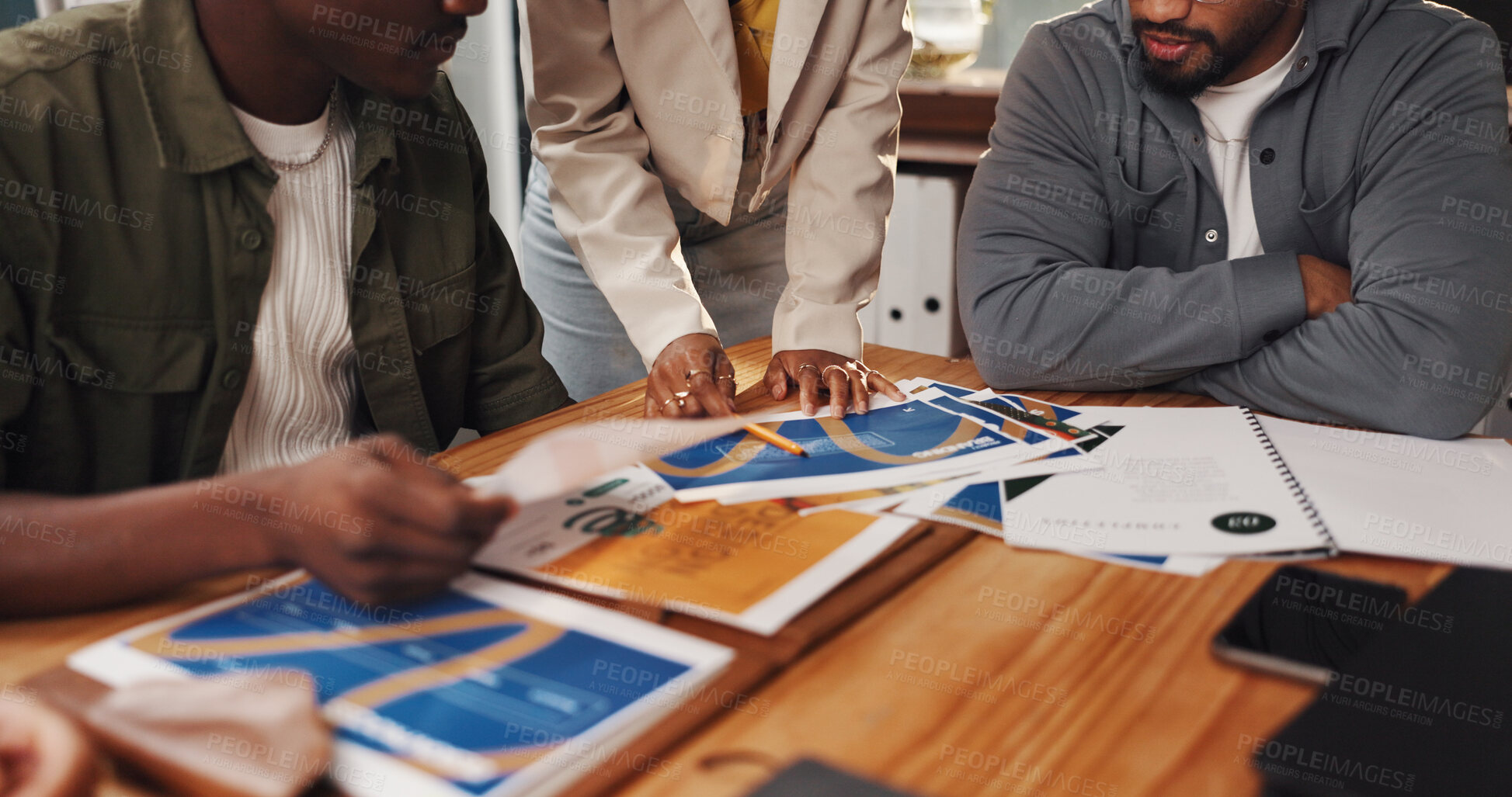 Buy stock photo Creative, documents and hands of business people in meeting for planning, teamwork and project ideas. Startup agency, collaboration and workers brainstorming for design process, feedback and strategy