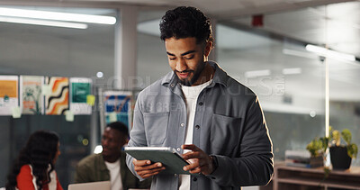 Buy stock photo Creative, man or happy with tablet in office for campaign brief, client email or logo design review. Night, overtime or graphic designer with digital app for branding guidelines or project management