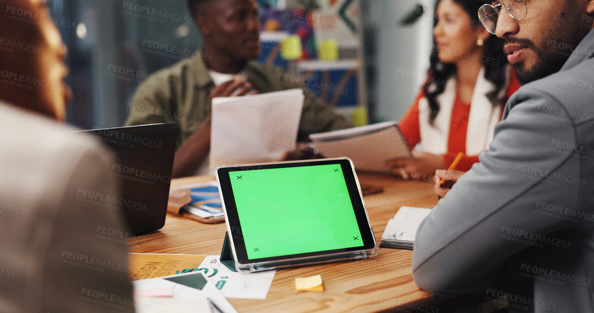 Buy stock photo Green screen, tablet and business people in office for meeting, graphic design and mockup space. Technology, display and creative team planning project with digital art for campaign or advertising