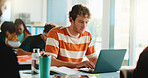 Laptop, college and typing with man in classroom for software bootcamp, web developer and research. Programmer course, coding scholarship and studying with male person on campus for tech lecture