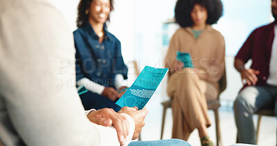 Buy stock photo Documents, people and support with mental health, hands and feedback in meeting. Group, pamphlet and men with women, discussion and information with wellness, stress relief and psychology with help