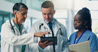 Buy stock photo Doctors, group and tablet with discussion, feedback and results with medical research at hospital. Healthcare professional, man and woman with app, report and review with team for solution at clinic