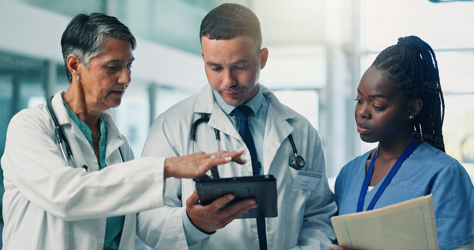 Buy stock photo Doctors, group and tablet with discussion, feedback and results with medical research at hospital. Healthcare professional, man and woman with app, report and review with team for solution at clinic