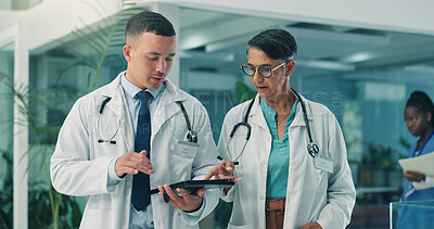 Buy stock photo Team, doctors and tablet in clinic for healthcare discussion, planning schedule or telehealth. Medical collaboration, man and woman with technology for wellness report, treatment advice and feedback