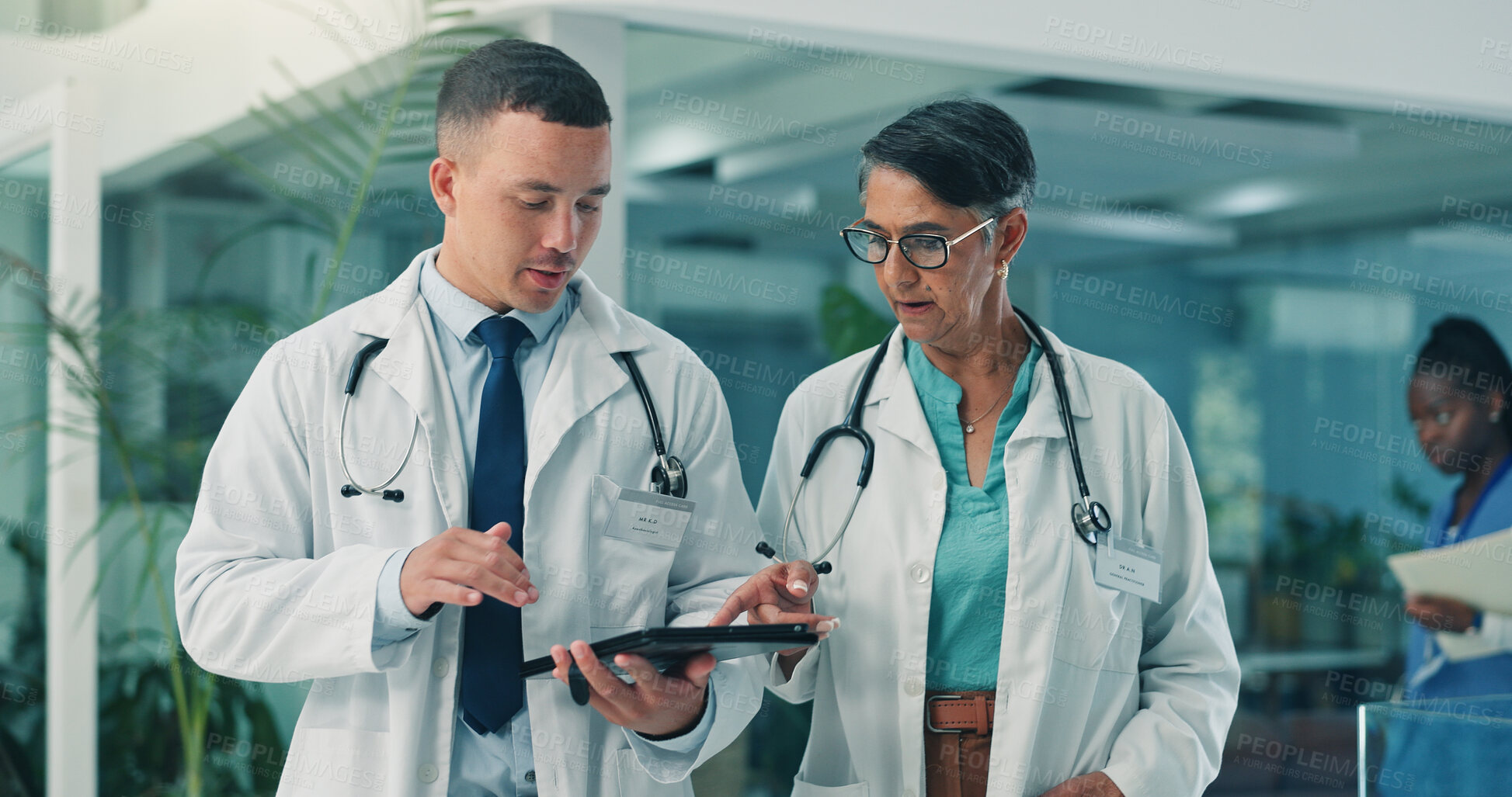 Buy stock photo Team, doctors and tablet in clinic for healthcare discussion, planning schedule or telehealth. Medical collaboration, man and woman with technology for wellness report, treatment advice and feedback