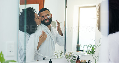 Buy stock photo Mirror, kiss and hug with couple for skincare, morning routine and together in home bathroom. Funny joke, smile and lotion with man, woman and reflection in apartment for love, beauty or bonding