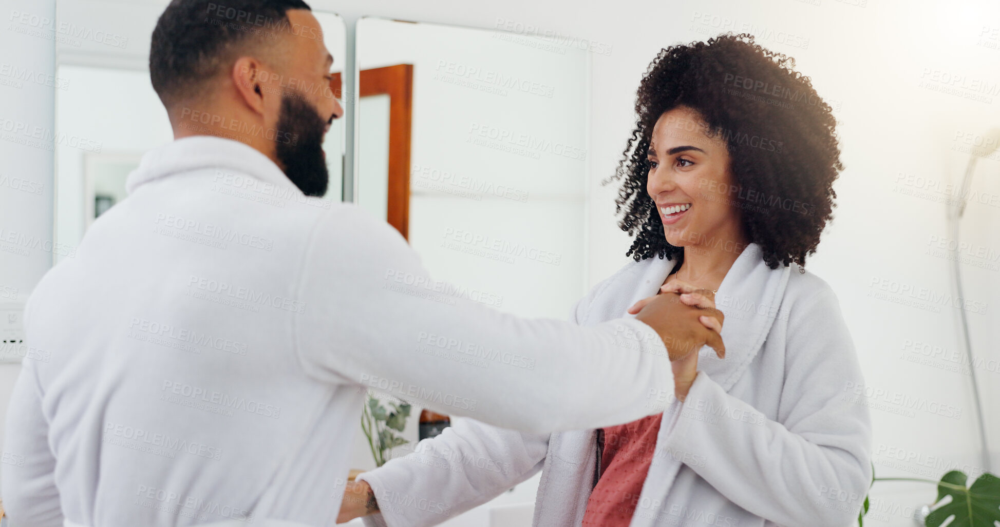 Buy stock photo Happy couple, dancing and morning in bathroom for energy, routine or spa day together in home. Dancer, man and woman with smile, motion or love in robe for movement, fun treatment or vibe in house