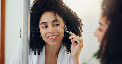 Buy stock photo Woman, mirror and roller for skincare at house for grooming, lymphatic drainage and natural beauty. Smile, female person and reflection with jade cosmetics, facial massage and dermatology benefits