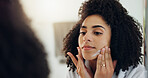 Beauty, lotion and mirror with woman in bathroom of home to apply facial product to skin. Cream, moisturizer and reflection with African person in apartment for cosmetics, dermatology or skincare