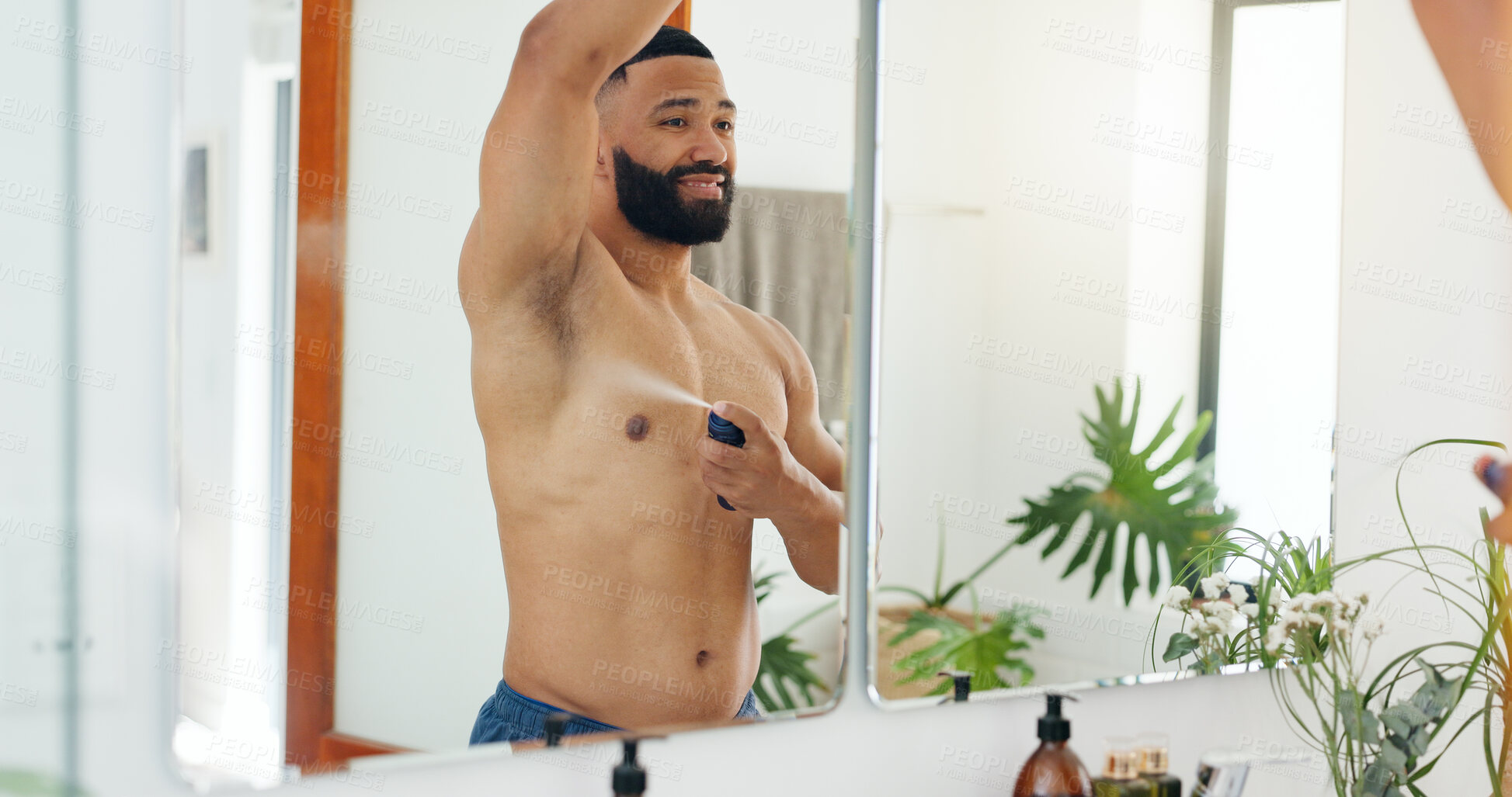 Buy stock photo Happy man, spray and armpit with mirror for hygiene, cosmetics or clean fragrance in home. Male person, smile and deodorant with body mist or reflection for skincare, perfume or cologne in house