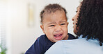 Family, mother and comfort crying baby in home with frustration, teething and hungry. Single mom, woman and attention to sad kid for infant care, space and console child with parenting and connection
